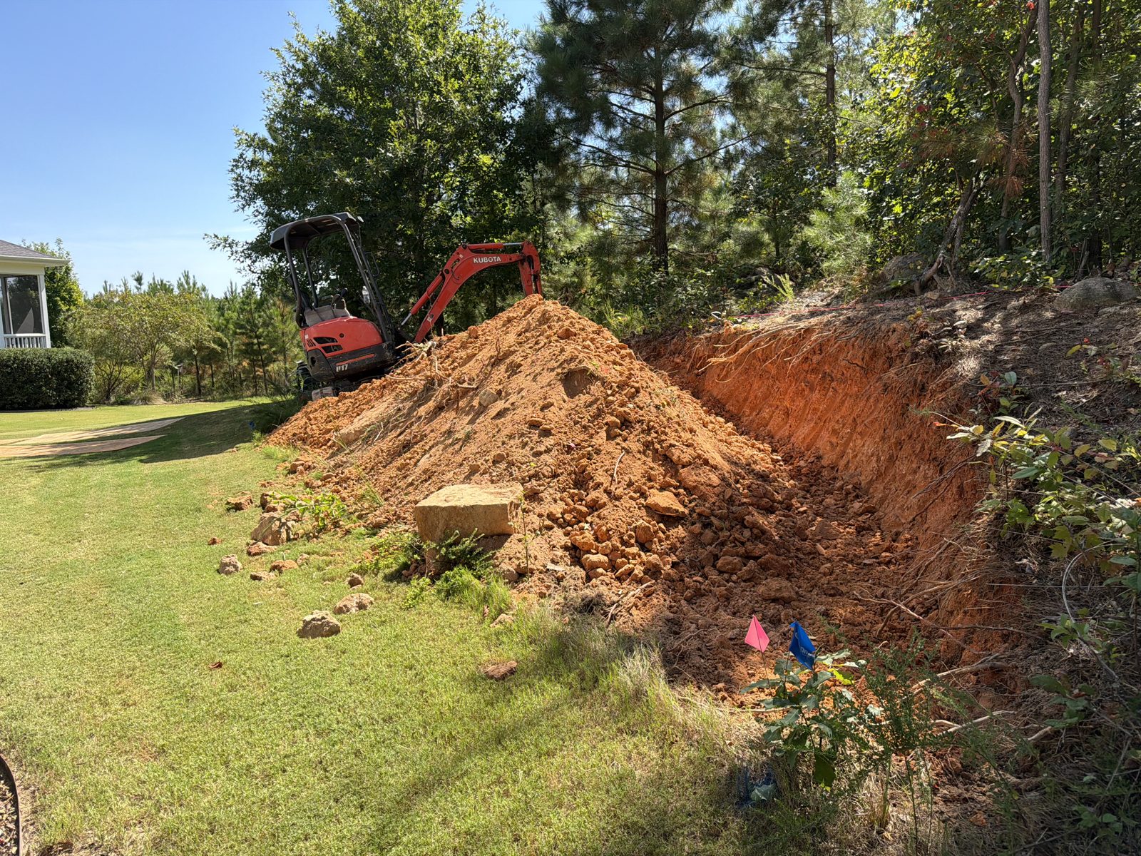 Cutting back a slope to make room for a retaining wall